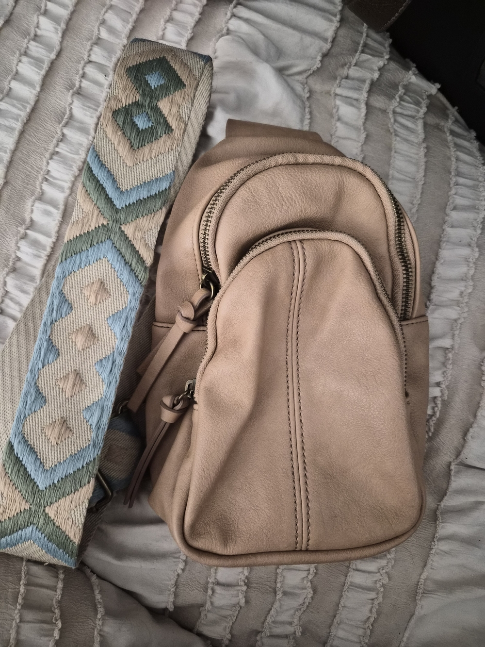 Beige Leather Crossbody Backpack with Decorative Strap